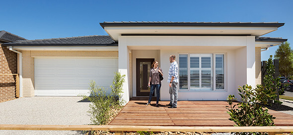 First home buyers in front of their new Orbit Home